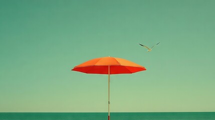 Fototapeta premium A red and orange umbrella rests atop a wooden pole beside a soaring seagull above the ocean