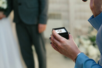 Wedding rings at the ceremony, foreground. Ceremonies in a restaurant