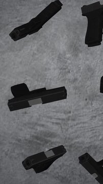 Guns. Pistols isolated on the grey wall. Guns revolve
