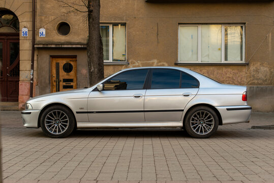 Ivano-Frankivsk, Ukraine - 10 Oct 2023: BMW 5 Series (E39) is the fourth generation of the BMW 5 Series range of executive cars. Side view. Car on street parking