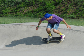 Skateboard boy skating on outdoors park.