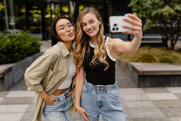 two young pretty women students in street