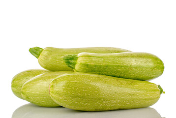 Several ripe zucchini, macro, isolated on white background.