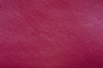 Red macro leather texture,Texture of artificial leather scarlet color,Leather samples with stitches