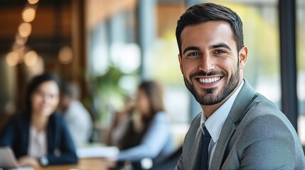 Fototapeta premium Confident and Successful: A charismatic businessman exudes confidence and success with a bright smile, a sharp suit, and a professional demeanor. 