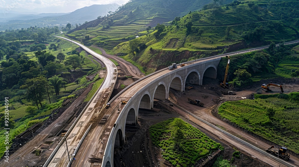 Poster a large-scale infrastructure project, with bridges and tunnels being constructed to improve transpor