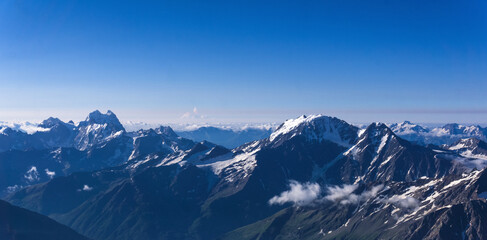 panoramic view of snowy high mountain peaks, Caucasus ridge.