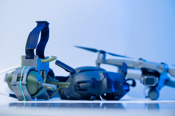Army drone with mechanism for dropping grenades, glasses for fpv, blue light. Concept modern military robot UAVs using in weapon, Engineering development for war