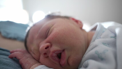 Close-up of newborn baby sleeping peacefully with eyes closed, detailed shot of serene and restful expression, cozy indoor environment, capturing tranquility and innocence of infancy