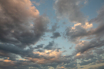 Cloudscape, Colored Clouds at Sunset near the Ocean in a Cloudy Day