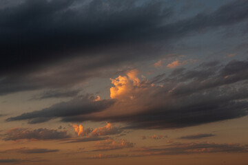 Cloudscape, Colored Clouds at Sunset near the Ocean in a Cloudy Day