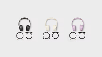 Black, Cream and Violet headphones with cables on copy-space background.