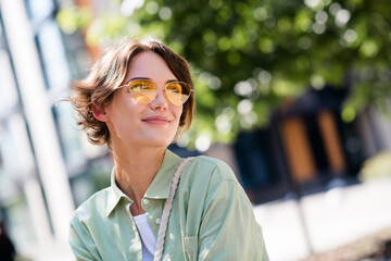 Photo of adorable dreamy girl enjoying spring weather free time harmony weekend moment fresh air