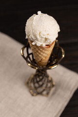 Vanilla ice cream in a waffle cone