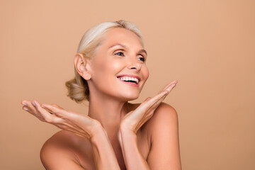 Photo portrait of attractive older woman 50s middle aged face skin pampering healthy care shoulders...