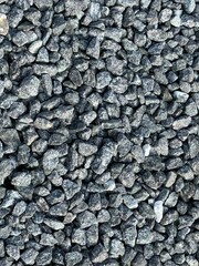 Crushed grey stone on the ground texture background