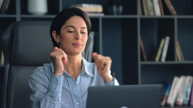 Confident businesswoman leading virtual meeting from office