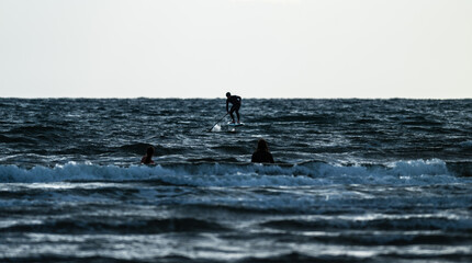 Person SUP foiling on a windy day.