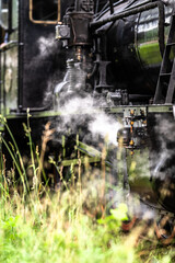 Details of a black steam train.