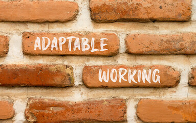 Adaptable working symbol. Concept words Adaptable working on beautiful brick wall. Beautiful red brown brick wall background. Business Adaptable working concept. Copy space.