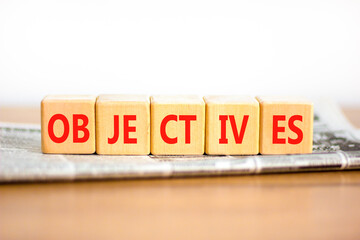Objectives symbol. Concept word Objectives on beautiful wooden blocks. Beautiful wooden table white...