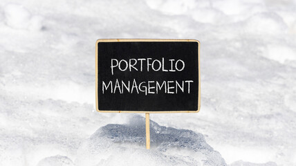 Portfolio management symbol. Concept words Portfolio management on beautiful yellow blackboard. Beautiful white snow background. Business Portfolio management concept. Copy space.