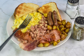 scramble eggs   with home fries, bacon sausage and toast
