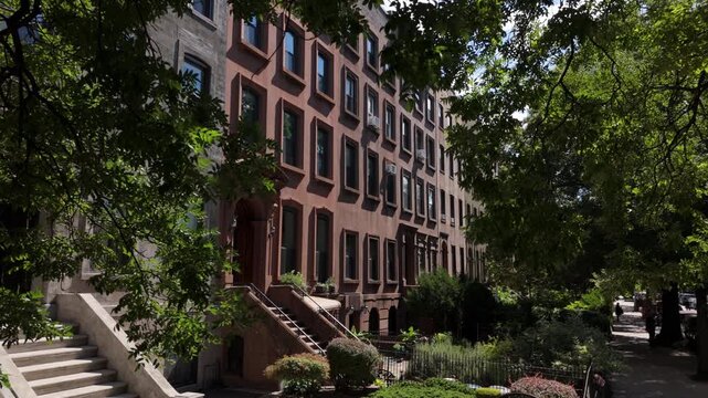 alt slower sunny flying towards brownstone houses in Carroll Gardens Brooklyn