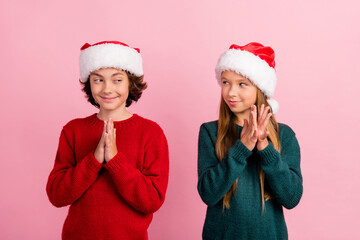 Photo of two kids girl boy thinking cunning on christmas time isolated pastel color background