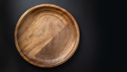 Handcrafted round wooden plate. Empty plate for food. Mock-up. Close-up. Top view