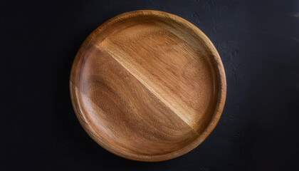 Handcrafted round wooden plate. Empty plate for food. Mock-up. Close-up. Top view