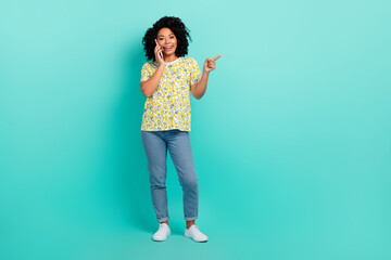 Full size photo of nice young woman communicate phone wear t-shirt isolated on teal color background