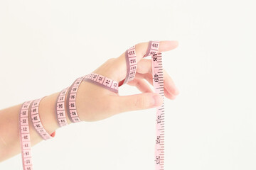 woman measuring her waist