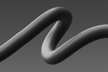 Curved black sculpture with smooth lines against a gray background