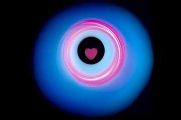 Pink heart at the center of glowing blue and pink rings.