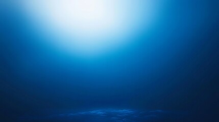 Fototapeta premium Sunlight filters through clear blue water in an underwater scene