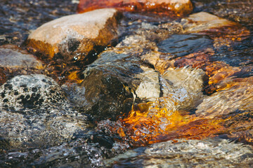 close up of a river with rocks. Clear river water in patagonia