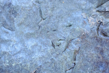 gray  plastic texture from a piece of crumpled dirt cellophane with a  holes