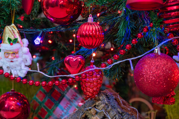 front view for christmas tree with focus on it is red decorations