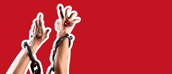 Zombie hands with shackles on red background. Halloween celebration