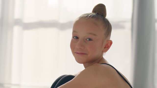 Caucasian kid little girl daughter pretty healthy smiling child orphan teenager sport gymnast dancer ballerina pupil student schoolgirl smile positive happy childhood custody adoption looking camera