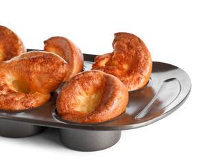 Baking tin with tasty Yorkshire pudding isolated on white background