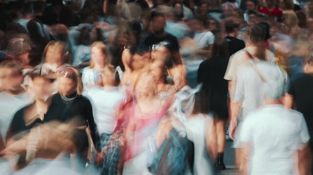 Time-lapse unrecognizable blurry huge crowd of people crossing city street, busy crossroad fast motion, many pedestrians walking crosswalk. Rush hour crowded, people walk, blurred faces and brands