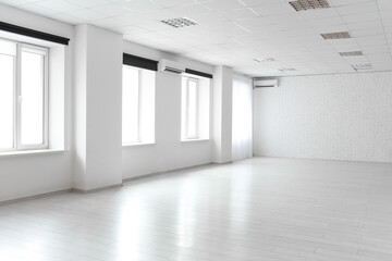Fototapeta premium View of big empty room with white brick wall