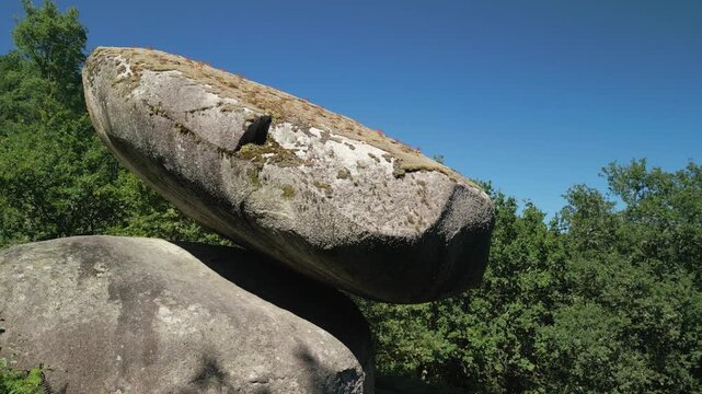 Close-up shot of Pena do Equilibrio, a formation of stacked boulders balanced on steep slopes.