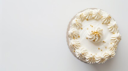 Simple white cake adorned with frosting and gold sprinkles, set against a white backdrop with space for text