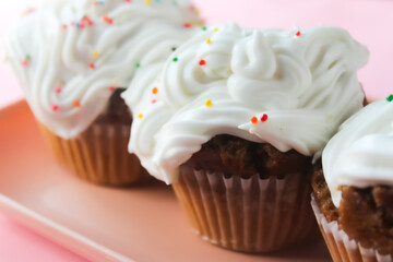 close-up of some cupcakes on a pink background