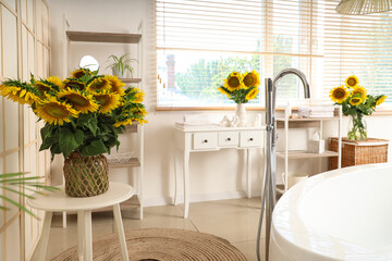 Bathroom full of vases with sunflowers