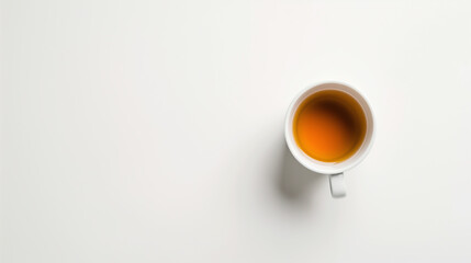 Golden Tranquility: A soothing cup of tea, shot from above, against a minimalist white backdrop, offering a sense of calm and warmth. 