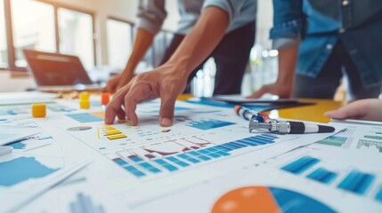 Generate a photo realistic image of a construction project team strategizing methods for budget tracking, with detailed financial charts and tracking tools; ensure the image is of high resolution 